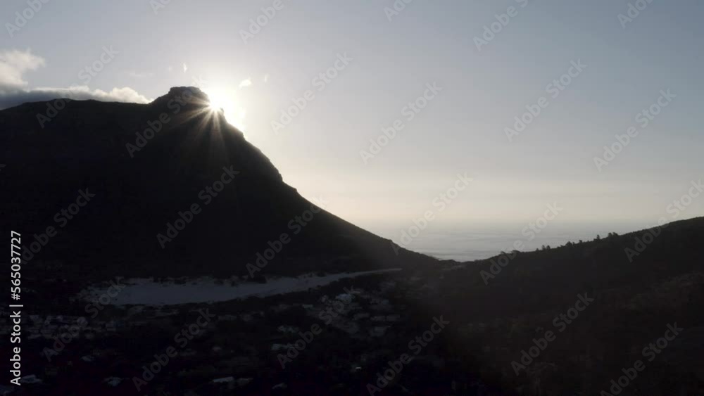 Aerial Mountain Silhouette Tracking Right Revealing Sun Flare at Golden Hour 4K Aerial Mountain Silhouette Tracking Right Revealing Sun Flare at Golden Hour 4K