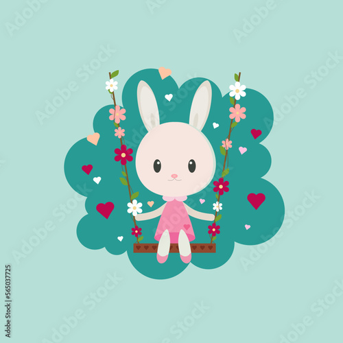 baby bunny in a dress swings on a swing