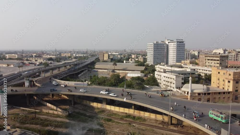 Aerial View Of Jinnah Bridge And Flyover Over Rotary Food Park In Karachi. Pan Right Aerial View Of Jinnah Bridge And Flyover Over Rotary Food Park In Karachi. Pan Right