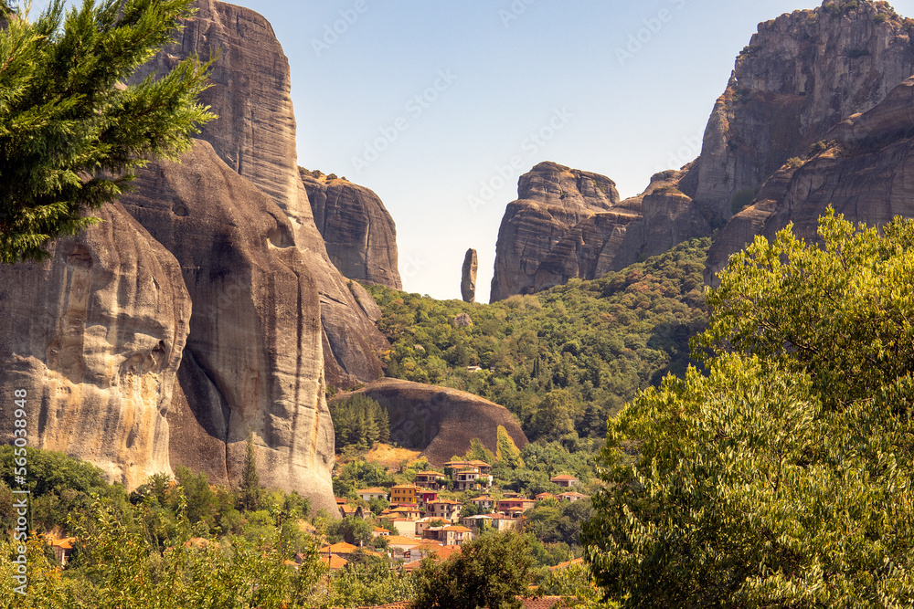 Rock formations of Meteora Greece with village in the foreground
