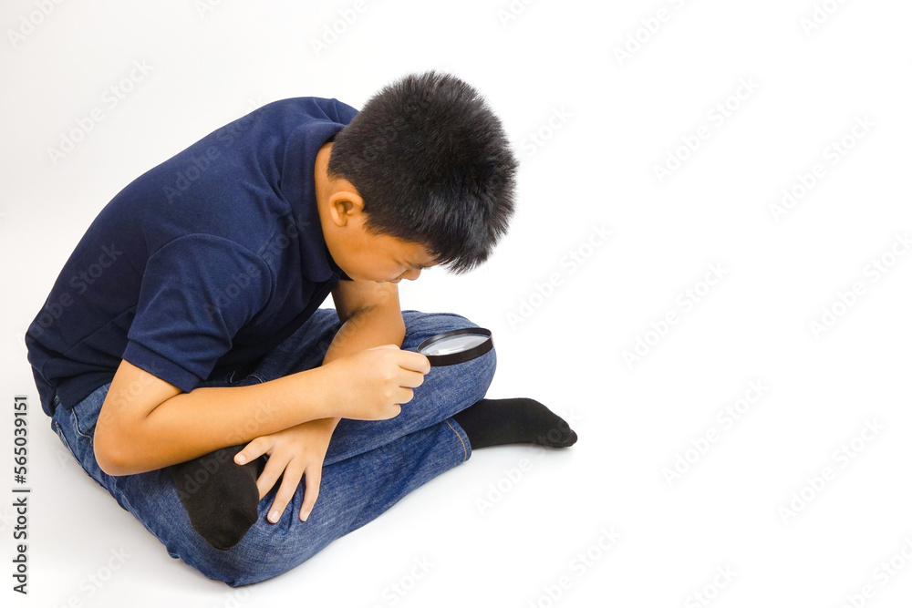 Boy holding a magnifying glass on white background. Knowledge, research and explore concept. Boy holding a magnifying glass on white background. Knowledge, research and explore concept.