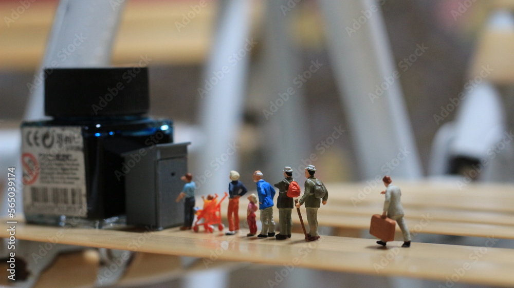 miniature figures of people queuing for public toilets. the concept of social etiquette. miniature figures of people queuing for public toilets. the concept of social etiquette.