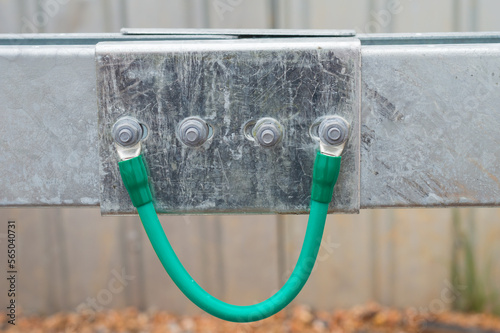 Electrical Wire way and Cable Ladder install at outdoor Area.Ground bonding cable between two Wire way .Ground Bonding for cable tray.Cable connected to electrical ground bar for safety