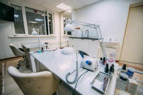 The interior of the nail salon without people. A bright, modern salon for the care of nails