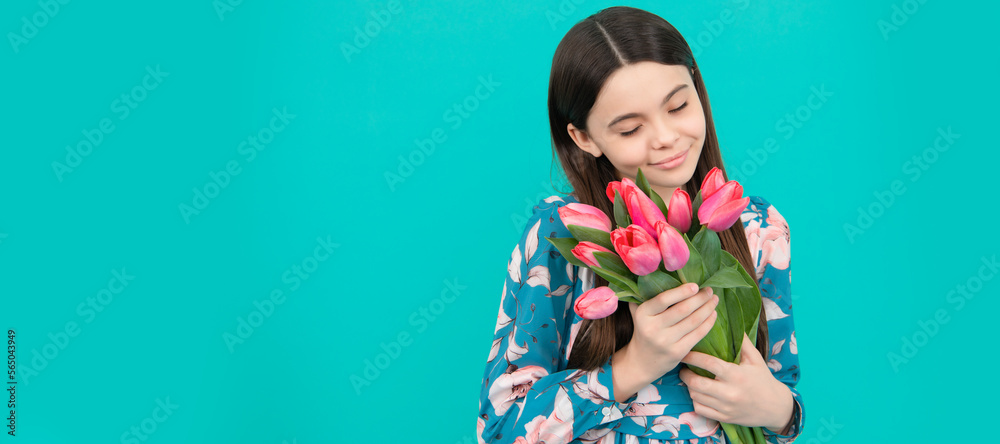 happy child smell tulips. mothers or womens day. kid hold flowers for 8 of march. Banner of spring child girl with tulips flowers bouquet, studio portrait with copy space.