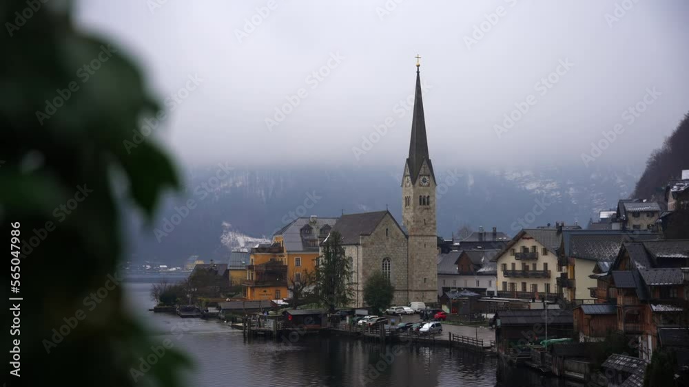 Clip filmed in Europe in Austria from a town called Hallstatt that's by a lake. Filmed in winter time in December of a beautifull town with houses and a church. Filmed in 4k with a smooth movement Clip filmed in Europe in Austria from a town called Hallstatt that's by a lake. Filmed in winter time in December of a beautifull town with houses and a church. Filmed in 4k with a smooth movement
