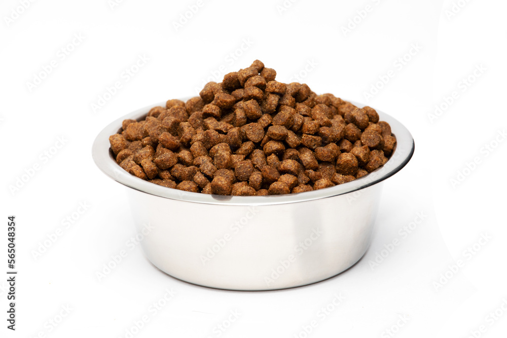 A bowl of dry cat food isolated on a white background A bowl of dry cat food isolated on a white background