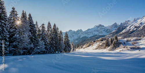 Beautiful winter mountain snow-covered landscape on sunny day. Andalo village, Adamello Brenta Natural Park, Trentino Alto Adige, northern Italy, Europe