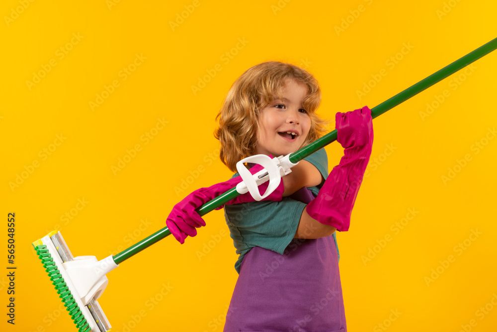 Cleaning house. Studio isolated portrait of child mopping house, cleaning home. Detergents and cleaning accessories. Cleaning service. Little boy funny housekeeper. Cleaning house. Studio isolated portrait of child mopping house, cleaning home. Detergents and cleaning accessories. Cleaning service. Little boy funny housekeeper.