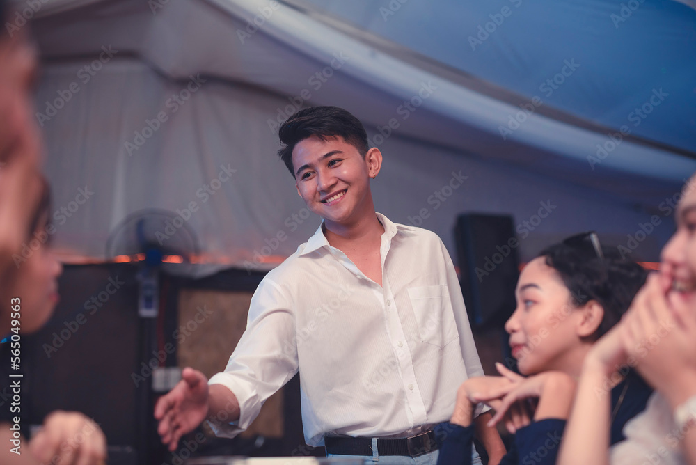 A good-looking young man introduces himself to a beautiful girl he has been admiring. Ladies uncomfortable with the presence of a cocky man initiating a handshake. A guy courting a lovely lady. A good-looking young man introduces himself to a beautiful girl he has been admiring. Ladies uncomfortable with the presence of a cocky man initiating a handshake. A guy courting a lovely lady.