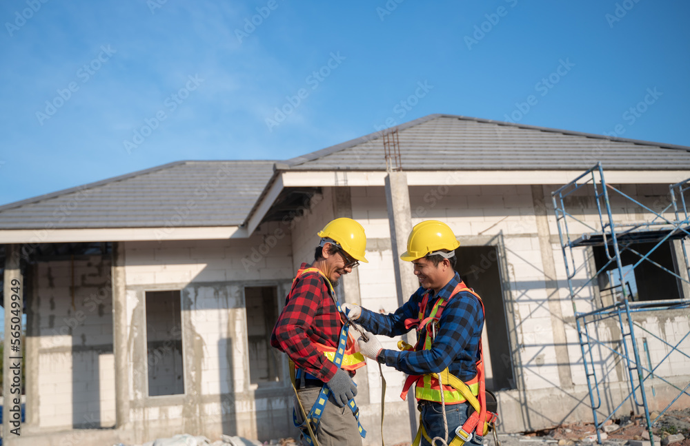 An engineering team prepares a safety suit before starting construction work. Construction workers rehearse and prepare safety clothes before starting work. An engineering team prepares a safety suit before starting construction work. Construction workers rehearse and prepare safety clothes before starting work.