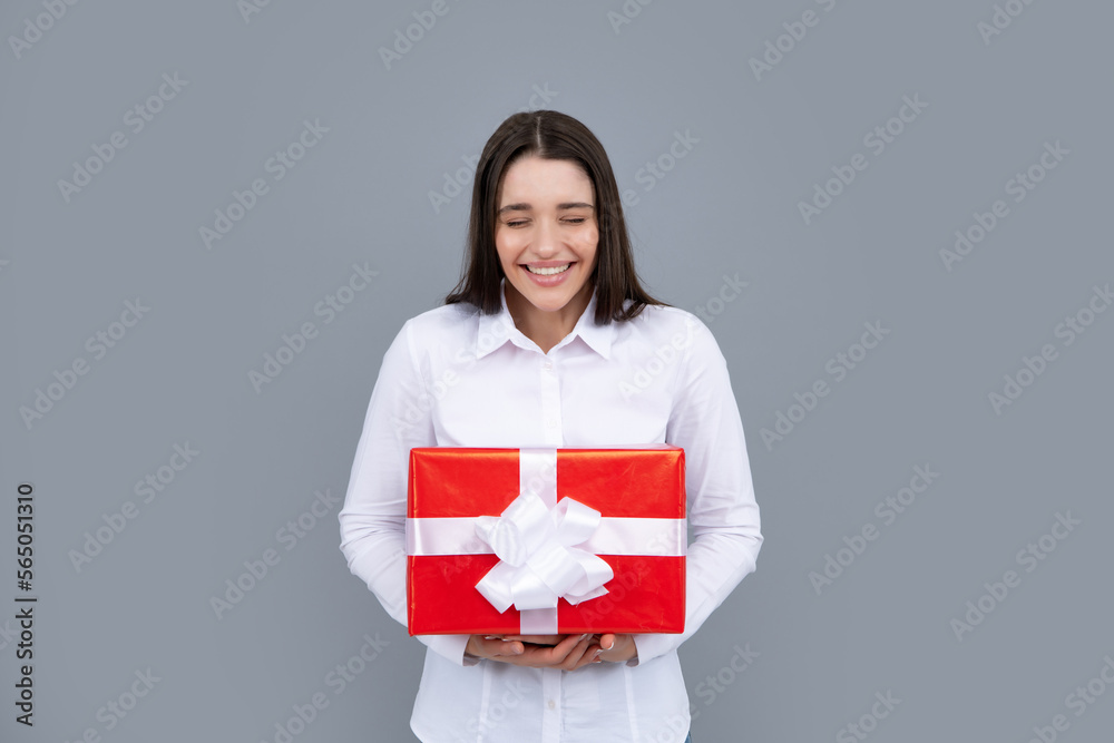 Holidays and celebration concept. Beautiful happy girl on birthday with gift. Young woman celebrating birthday, receive b-day presents. Holidays and celebration concept. Beautiful happy girl on birthday with gift. Young woman celebrating birthday, receive b-day presents.