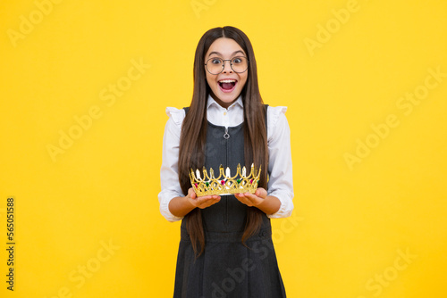 Girls party, funny kid in crown. Child queen wear diadem tiara. Cute little princess portrait. Excited face, cheerful emotions of teenager girl.