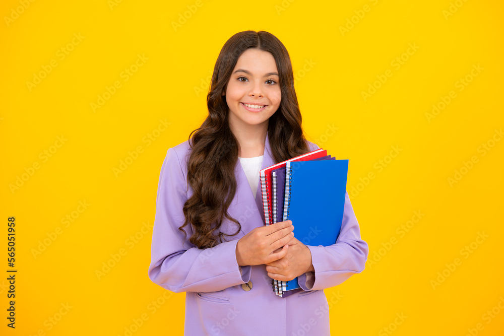 Schoolgirl with copy book posing on isolated background. Literature lesson, grammar school. Intellectual child reader. Schoolgirl with copy book posing on isolated background. Literature lesson, grammar school. Intellectual child reader.