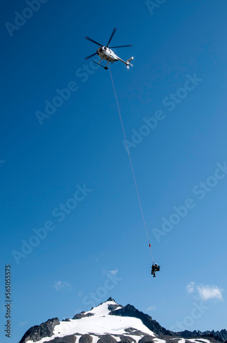 North Cascades National Park climbing ranger is short hauled via helicopter to assist in evacuation of injured climber.