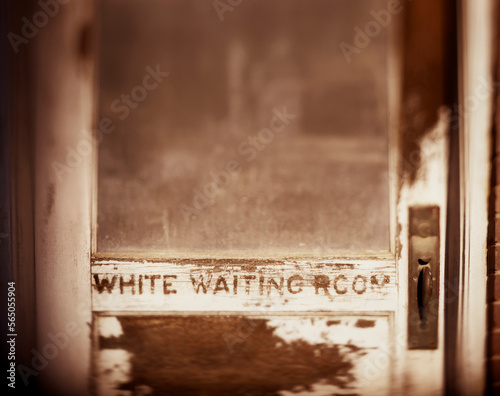 A retired train station still holds signs to the segregation of the past with separate waiting rooms. photo