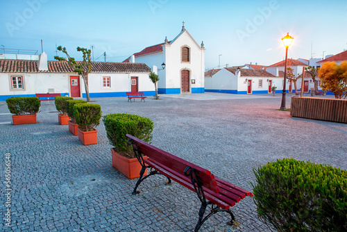 Sunset in the Portuguese town of Porto Covo. Their houses are painted white and decorated with numerous flowers. Sines photo