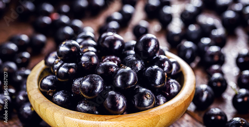 bowl with many jabuticabas, exotic south american grape native to brazil, bolivia and argentina, Brazillian tipical food photo