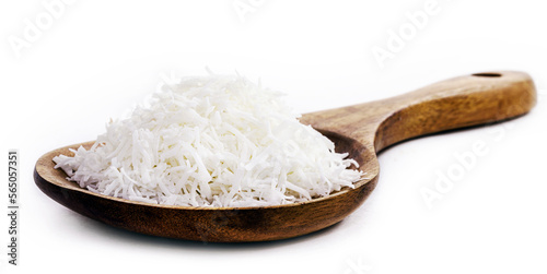 wooden spoon rustic with grated coconut on white background with copy space, culinary ingredient, Brazillian tipical food