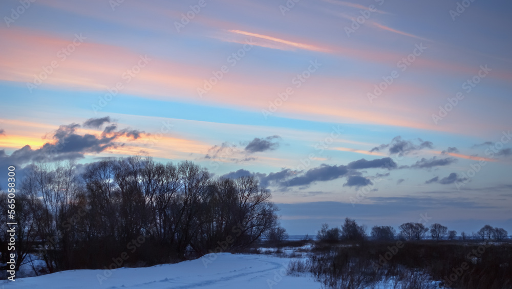Winter Evening Sky with Pink and Purple Clouds in Countryside