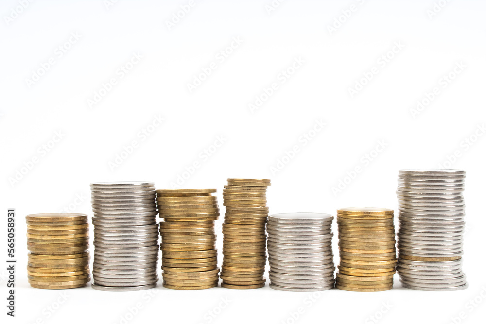 Gold towers made out of gold and silvery coins, stack isolated on white. Gold towers made out of gold and silvery coins, stack isolated on white.