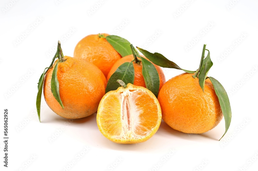 Clementines with leaves on white background. Clementines with leaves on white background.