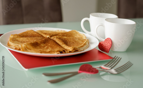 Idea for Valentine's Day surprise gift. Cute pancakes crepes with coffee or tea. Romantic valentine breakfast.
