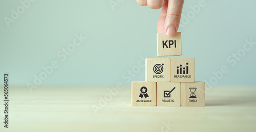 Effective and smart key performance indicators (KPIs) to measure and evaluate progress. Specific, measurable, achievable, realistic, timely. Tracking performance, setting goals and making decisions. photo