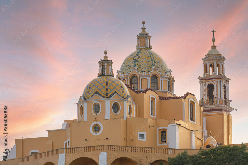 Los Remedios Sanctuary in Cholula Puebla on a hill, with the sunset in the background
