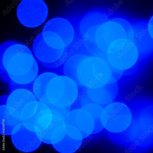 Blue blurred holiday lights. Defocusing.