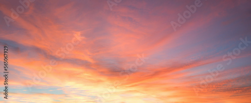 colorful sunset sky panorama with pink orange and yellow clouds