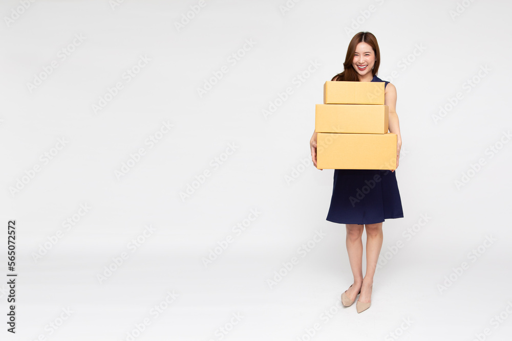 Full length portrait of Asian woman holding package parcel box isolated on white background, Delivery courier and shipping service concept Full length portrait of Asian woman holding package parcel box isolated on white background, Delivery courier and shipping service concept