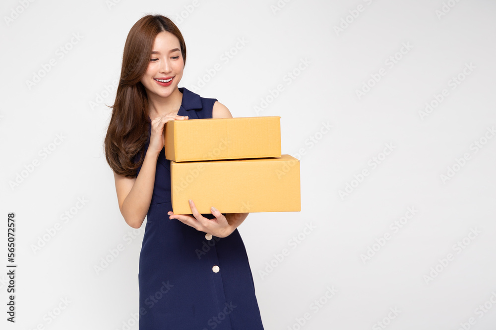 Asian woman holding package parcel box isolated on white background, Delivery courier and shipping service concept Asian woman holding package parcel box isolated on white background, Delivery courier and shipping service concept