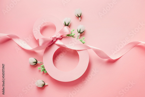 Postcard March 8. Paper number eight decorated with spring flowers on a pink background © Evgenia