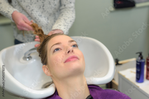 washing salon clients hair