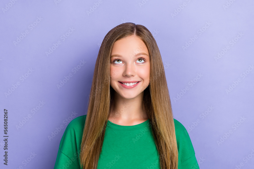 Photo of pretty cheerful lady wear stylish green clothes interested look empty space cool propositions isolated on purple color background Photo of pretty cheerful lady wear stylish green clothes interested look empty space cool propositions isolated on purple color background