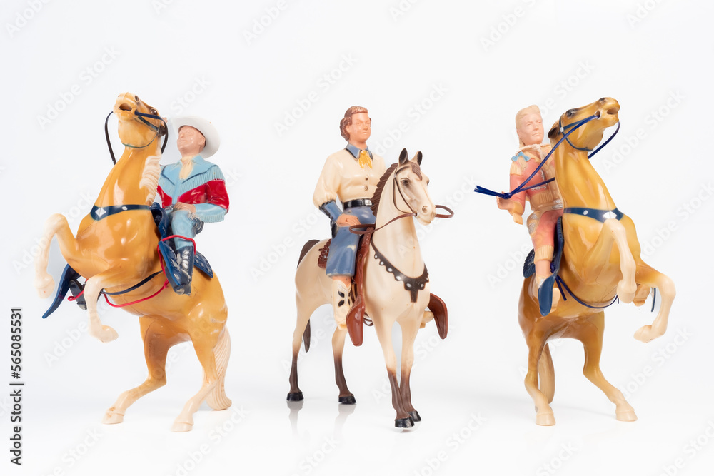 Obraz premium Vintage Toy Cowgirl and Cowboy Riders Group