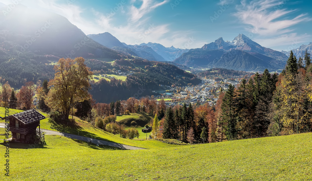 Beautiful nature landscape. Incredible autumn scenery. View on Alpine highlands with Watzmann mount, colorful trees and Small hut. famous tourist attraction. Berchtesgaden. Bavaria Alps. Germany