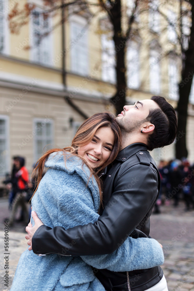 stylish happy couple enjoying a date on the street of a European city stylish happy couple enjoying a date on the street of a European city