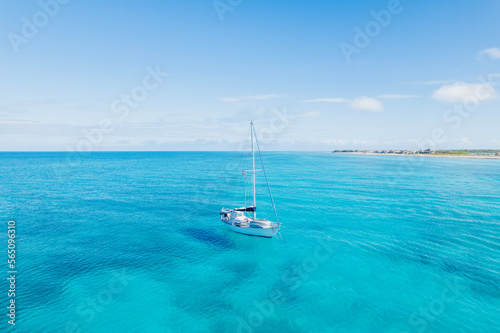 Aerial of Sailboat Anchored in Turquoise Blue Water in Bimini, Bahamas