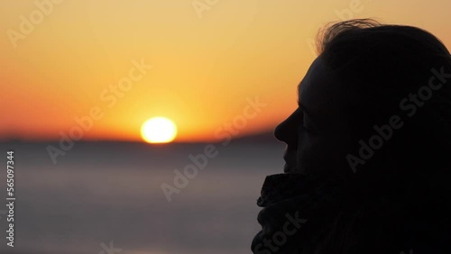 Wallpaper Mural thoughtful woman contemplates the sea at sunset absorbed in her thougts Torontodigital.ca