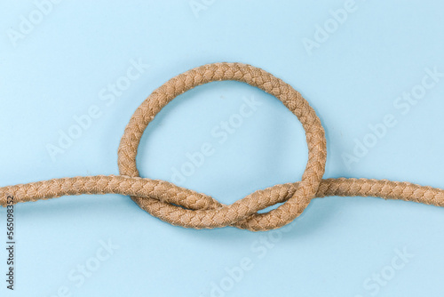 Rope knot as overhand knot on a blue background
