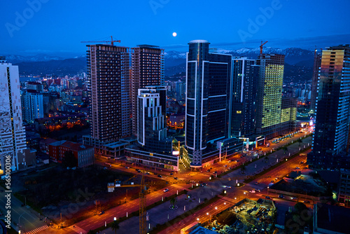 Evening landscape of the city of Batumi with the buildings in the evening illumination