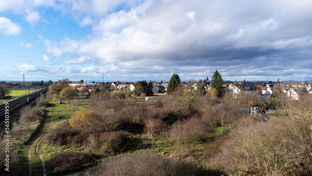 View from above over Weiterstadt-Braunshardt partly with railway tracks in cloudy winter weather