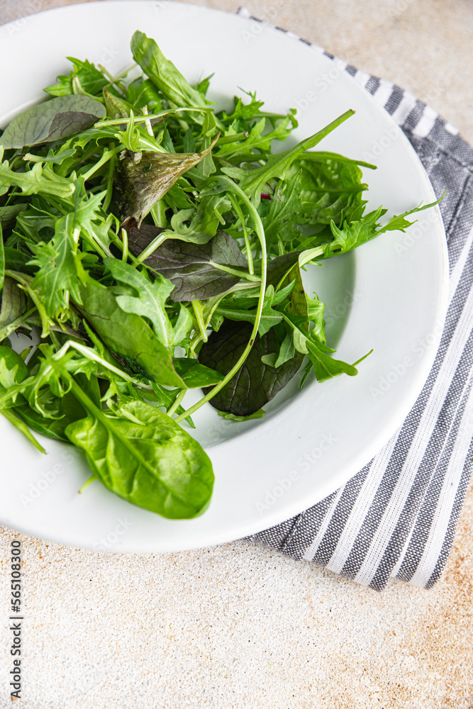 green salad leaves mix micro green, juicy healthy snack food on the table copy space food background rustic top view green salad leaves mix micro green, juicy healthy snack food on the table copy space food background rustic top view