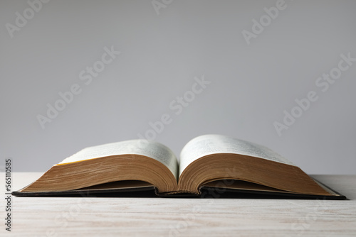 Canvastavla Open Bible on wooden table. Christian religious book