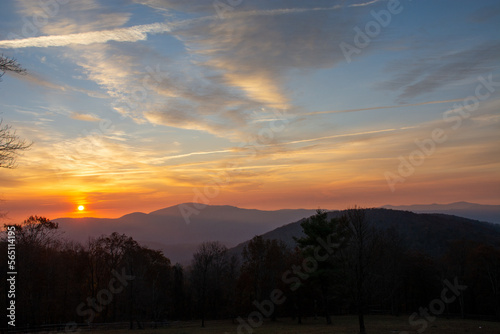 Sun rises fully above the mountains in the distance for a gorgeous Blue Ridge sunrise