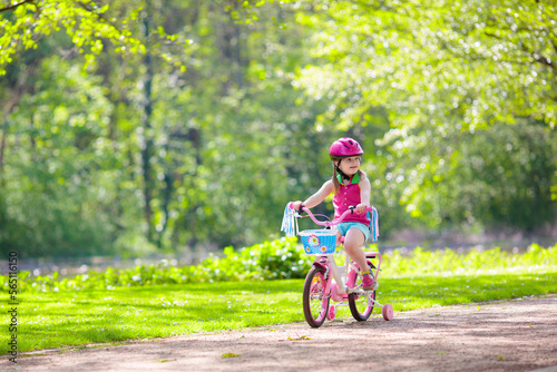 Fototapeta Naklejka Na Ścianę i Meble -  Child riding bike. Kid on bicycle.