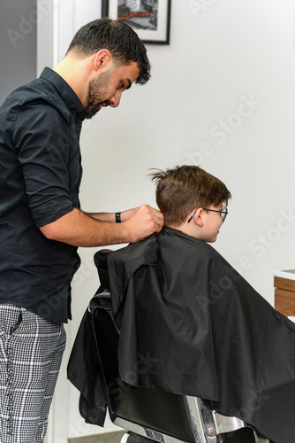 hairdresser doing styling for a client in the salon