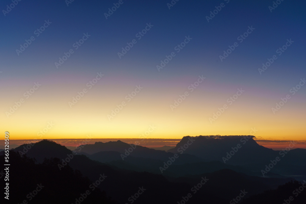 Mountain layers with colorful sky background. Beautiful silhouette landscape, Doi Luang Chiang Dao, Chiang Mai province in Thailand.